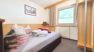 Postel nebo postele na pokoji v ubytování Appartements-Pension Reinstadler