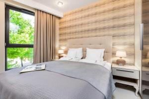 Posteľ alebo postele v izbe v ubytovaní Happy Stay OldNova Deluxe Apartment 335
