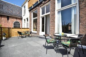 En terrasse eller udendørsområde på Bed & Breakfast De Barrels
