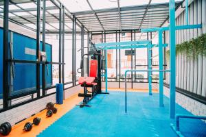 a gym with a tread machine in a building at Good Dream Hotel (Khun Ying House) in Ko Tao