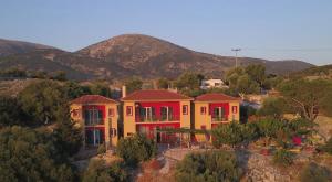 an aerial view of a house with mountains in the background at Art Studio Kefalonia in Dhavgáta