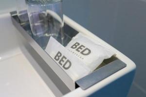 a plastic container with a bfd sign in it at BED Changkian - Adults Only in Chiang Mai