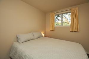 Voodi või voodid majutusasutuse Simon's Place - Kaikoura Holiday Home toas