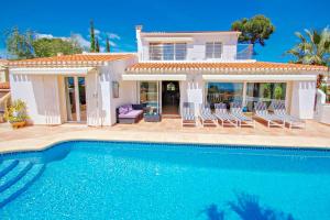 The swimming pool at or close to Michelle - sea view villa with private pool in Benissa