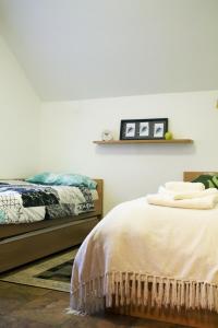 Postel nebo postele na pokoji v ubytování Apartma Pegaz