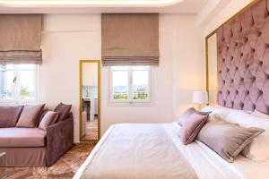 מיטה או מיטות בחדר ב-Pinelopi Beach Suites
