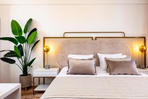 Postel nebo postele na pokoji v ubytování Pinelopi Beach Suites