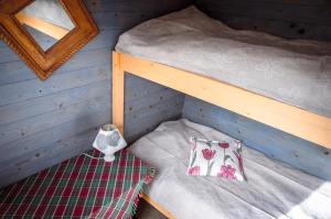 a bedroom with a bunk bed in a house at Änggårde B&B in Huse