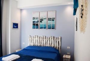 Postel nebo postele na pokoji v ubytování Neapolis Pie