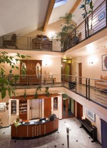 a large building with a staircase and a lobby at Hotel Blankenfeld in Wetzlar