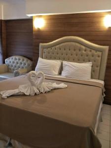 Postel nebo postele na pokoji v ubytování SUDYOD HOTEL