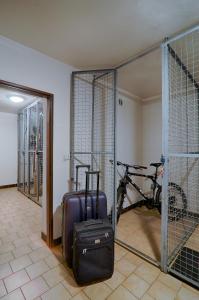 a room with a bike and a suitcase in a room at Apartment Michaela in Pec pod Sněžkou