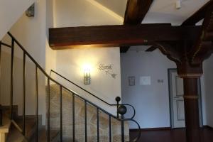 a staircase with a light on the wall and a lightswitch at Altes Rathaus Hotel-Restaurant-Café in Wolfhagen