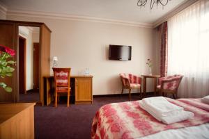 Postel nebo postele na pokoji v ubytování Hotel przy Młynie
