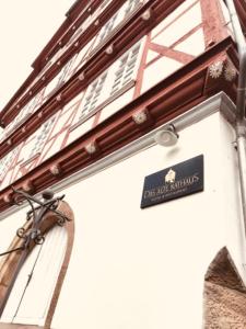 a sign on the side of a building at Altes Rathaus Hotel-Restaurant-Café in Wolfhagen