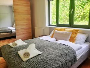 Posteľ alebo postele v izbe v ubytovaní Apartamenty Złoty Widok