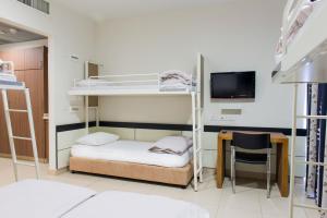 Postel nebo postele na pokoji v ubytování HI - Poriya Hostel + 16 fotografií