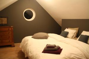 Postel nebo postele na pokoji v ubytování B&B Les Dépendances