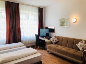 TV a/nebo společenská místnost v ubytování Hotel Verdi