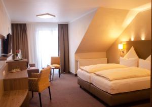 Postel nebo postele na pokoji v ubytování Hotel Morjan
