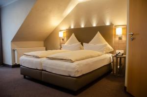 Postel nebo postele na pokoji v ubytování Hotel Morjan