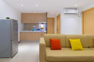 Kuchyň nebo kuchyňský kout v ubytování Foshan Laide Apartment