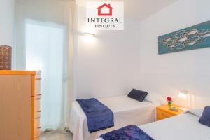 Posteľ alebo postele v izbe v ubytovaní Paradís Platja Apartment