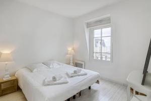 Ένα ή περισσότερα κρεβάτια σε δωμάτιο στο Le Grand Sillon