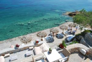 an aerial view of a beach with chairs and umbrellas at Kekrifalia Hotel in Skala