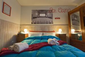 Postel nebo postele na pokoji v ubytování Hotel La Pace