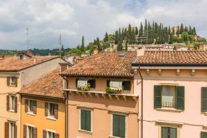 a view of roofs of buildings in a city at Luxury Design Apt with Amazing View in Verona