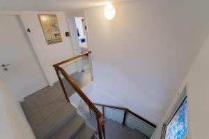 a staircase in a house with a stair case at Eilot in Eilat