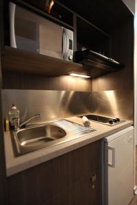 Kuchyň nebo kuchyňský kout v ubytování Geneva Residence + 36 fotografií