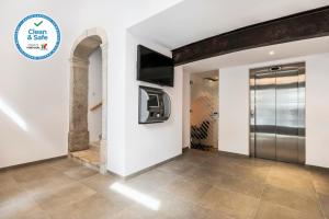 TV a/nebo společenská místnost v ubytování Garrett 48 Apartments
