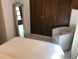 A bed or beds in a room at Embrujo