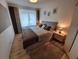 Postel nebo postele na pokoji v ubytování Apartmán pod hradem