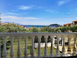 a balcony with a view of the ocean at VILLA TASOS in Iraklitsa