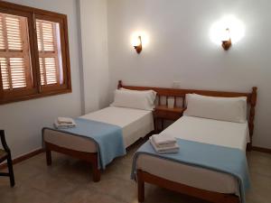 Ένα ή περισσότερα κρεβάτια σε δωμάτιο στο Apartamentos La Cabaña