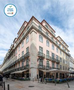 a large building with balconies on the side of it at Living Lisboa Baixa Apartments in Lisbon