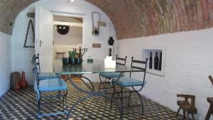 a dining room with a glass table and chairs at Nature House Arany in Zalaszentgrót