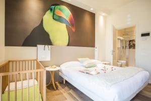 A bed or beds in a room at Hotel La Fenice