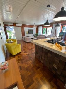 a large living room with a kitchen and a living room at Oasis Hotel in Palmitos