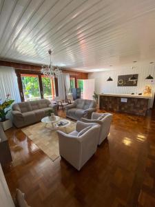 a large living room with couches and a fireplace at Oasis Hotel in Palmitos