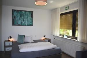 Postel nebo postele na pokoji v ubytování Hotel Hegemann garni