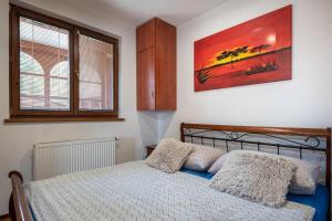 Postel nebo postele na pokoji v ubytování CHATY - woodyganovce sk