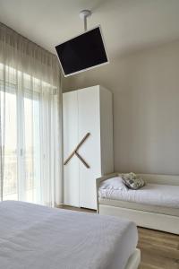 A bed or beds in a room at Hotel La Fenice