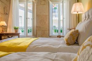 Posteľ alebo postele v izbe v ubytovaní Casa del ancla