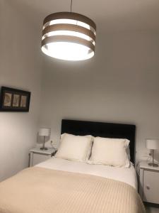 A bed or beds in a room at Embrujo