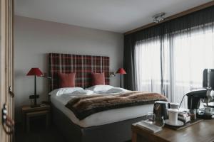 Rúm í herbergi á Eco & Wellness Boutique Hotel Sonne