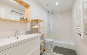 a white bathroom with a sink and a toilet at OrangeTreeHouses in Montijo +72 photos